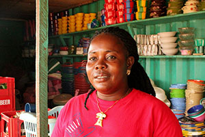 Tina Tuonyon is a 37-year-old single mother who used to sell charcoal at a small market stall. She is now across-border trader with a big clothing and household goods shop. Photo: UN Women/ArwenKidd