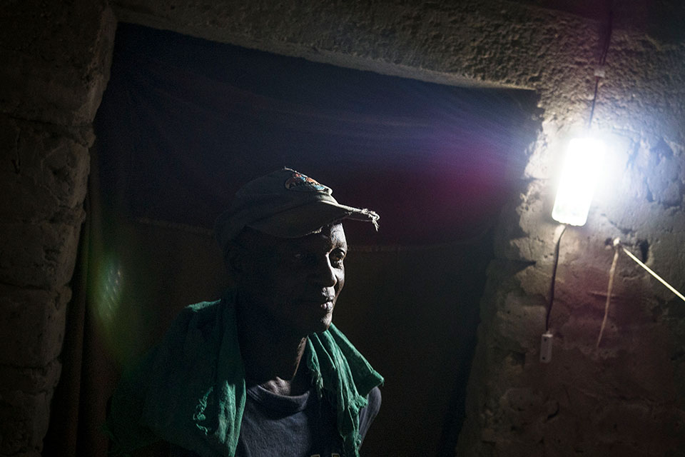 57-year-old Anthony Sorbor of Todee Community has electricity for the first time and no longer worries about finding money to buy candles or kerosene. Photo: Thomas Dworzak/Magnum Photos for UN Women