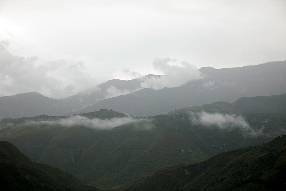 Views of misty mountains from the municipality of El Tablón de Gómez, in the southeast of Nariño territory, Colombia. The municipality is known for its coffee and scarred by decades of conflict between the Colombian guerillas.