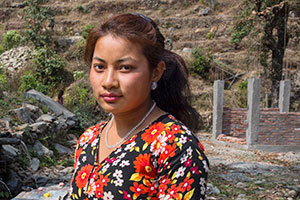 Sita Shrestha stands infront of community tab at Irkhu VDC-7 in Sindhupalchwok, Nepal. Photo: UN Women/N. Shrestha